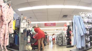 video of In the store upskirt girl in red dress