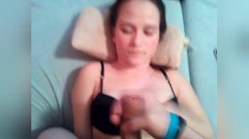 video of Cute girl in black bra lying down playing with dick
