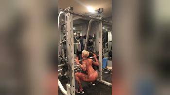 video of tattoed blond with short hair doing fitness