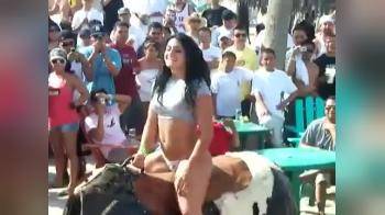 video of Girl and a mechanic bull