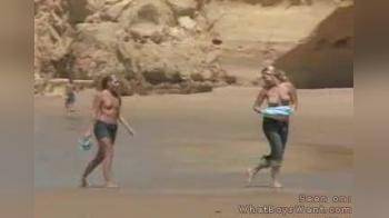 video of 2 topless on beach