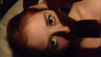 video of redhead in pigtails sucking a massive schlong