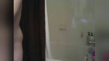 video of Skinny blonde showering and playing