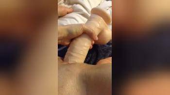video of Playing with a large dildo close up