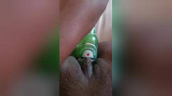 video of Beer bottle slowly inside puss ebony