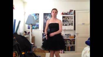 video of College girl in black dress strips and plays