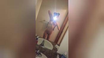 video of Beauty flashing her body in front of the window