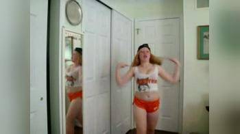 video of Redhead hooters girl dancing