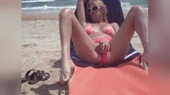 video of Horny Wife Masturbates at the Beach