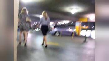 video of following two girls in the parking garage
