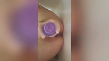 video of close up of her playing with her dildo