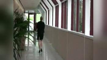 video of Another girl in hallway walking away spy cam