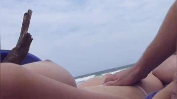 video of Topless girl fingered her pussy on the beach