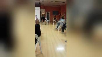 video of Girl bating in front of crowd on seminar