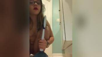 video of really nerdy girl on the floor playing with her pussy