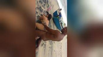 video of White girl getting doggy fucked on the beach