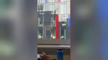 video of Couple fucking against the window