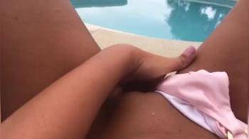 video of Bating herself at edge of the swimming-pool