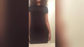 video of Black girl in black dress flashing her amazing body