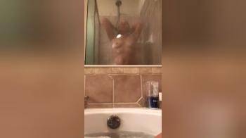 video of Filming my wife showering while I take a bath