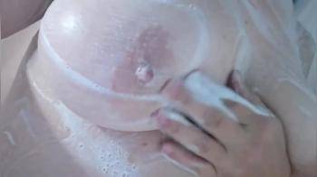 video of Chubby wife with big tits soaping up her body under the shower