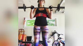 video of Brunette woman training biceps