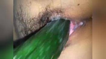 video of Using cucumber to make her pussy ready for a large dick