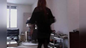video of Red head dancing in her living room and flashing tits