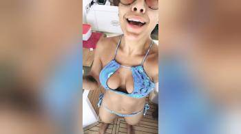 video of Bikini Latina with sunglasses selfie singing