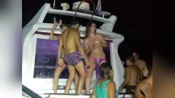 video of Topless girl dancing on a boat party