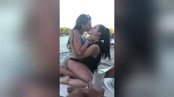 video of Two girl kissing on a boat