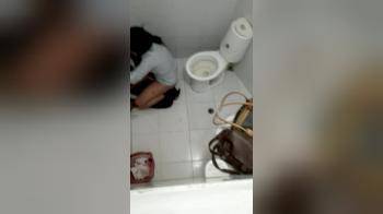 video of Two girl enjoying each other on toilet at a party