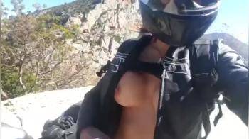 video of Motorcycle chick flashing her tits with a gorgeous view