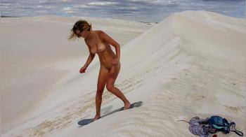video of sandboarding naked from a dune