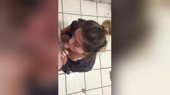 video of Brunette sucking short cock in public toilet 