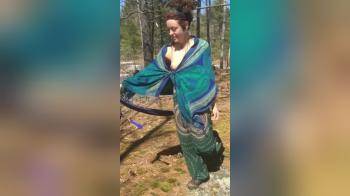 video of Spiritual girl strips down topless in nature