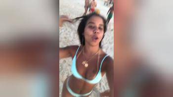 video of skinny Latina with her friend on the beach