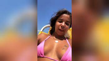 video of Latina talks a lot on the beach in her bikini