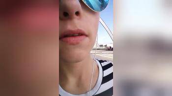 video of Girl with glasses on licking her lips