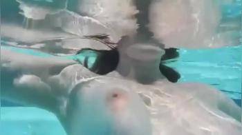 video of Bating herself under water in the pool