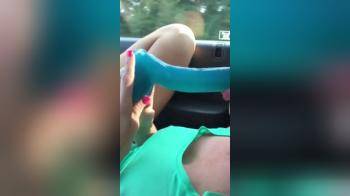 video of Driving on the road pleasuring herself with a blue friend