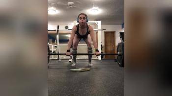 video of Squating girl with weights 