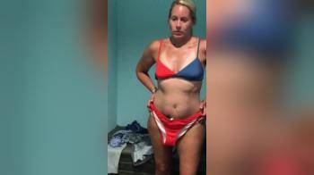 video of Milf trying some bikinis in dressing room