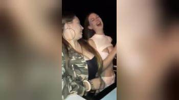video of Two hot girls flashing tits and kissing in Limo