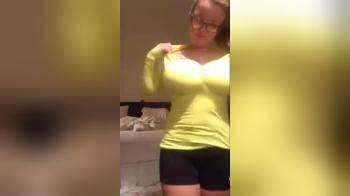 video of Girl in yellow sweater stripping down naked