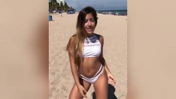 video of Cute latina dancing on the beach
