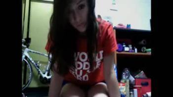 video of Pretty long haired babe strips & plays on laptop
