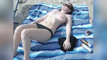 video of On the beach sunbating topless