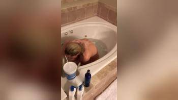 video of My hot wife taking a bath and playing a little