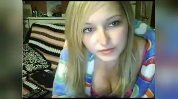 video of Blonde bored with tv shows of on her laptop 